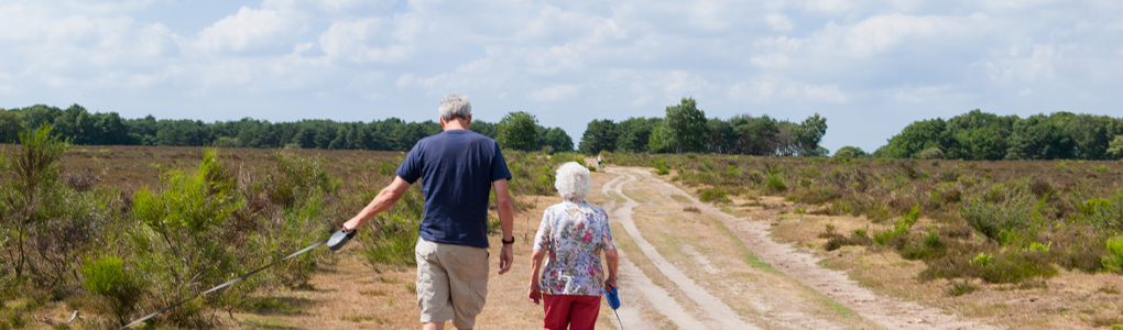 A healthy couple walking after care from their orthopedic provider.